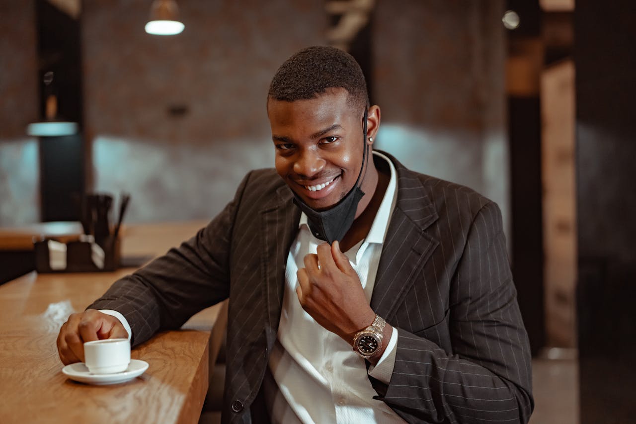 A Man in a Smart Casual Outfit at a Coffee Shop